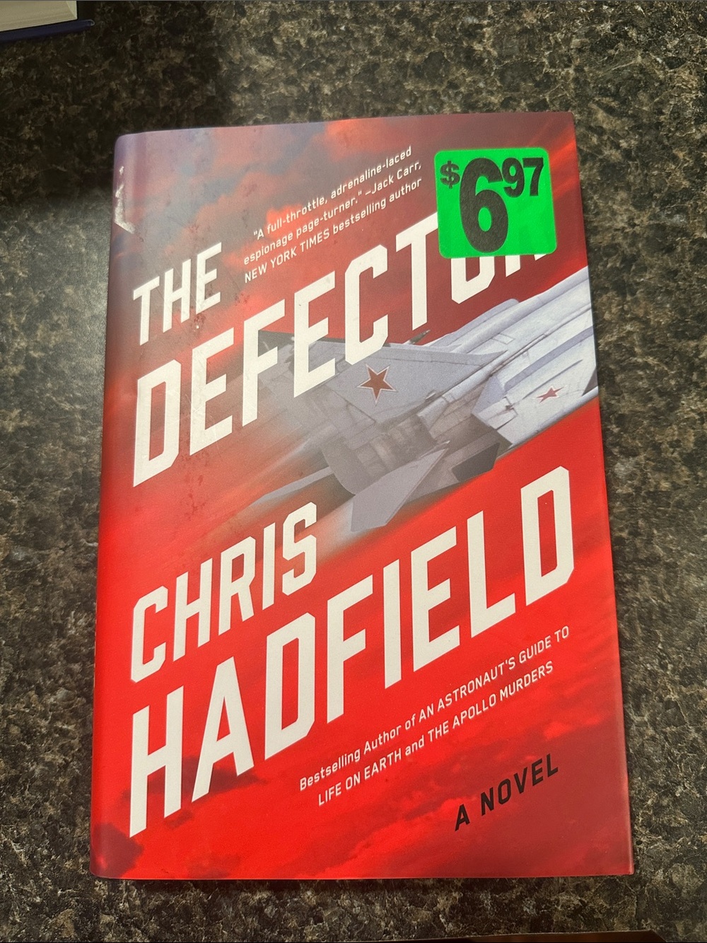 The Defector by Chris Hadfield - Red Paperback Novel